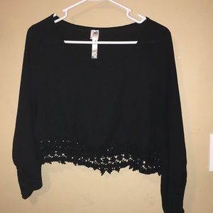 Woman’s black long sleeve crop top